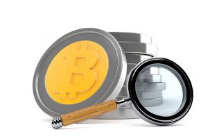 Bitcoin with magnifying glass isolated on white background